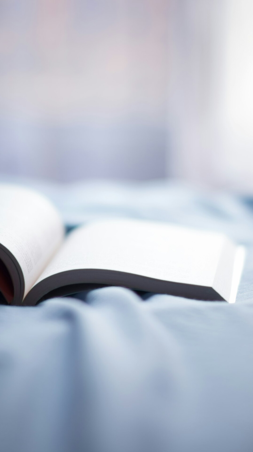open book on bed