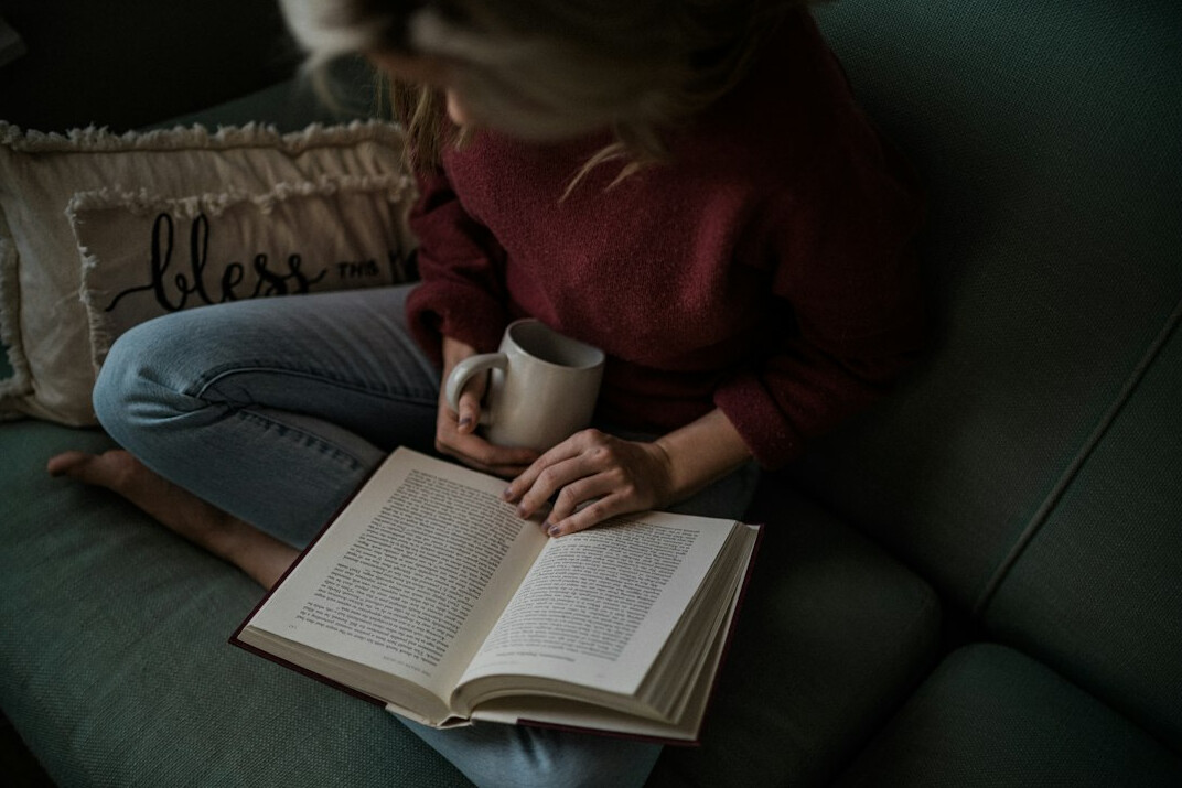 person reading thriller book