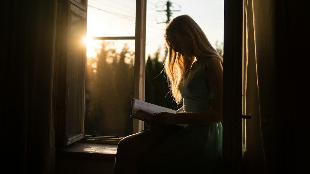 woman reading old letter